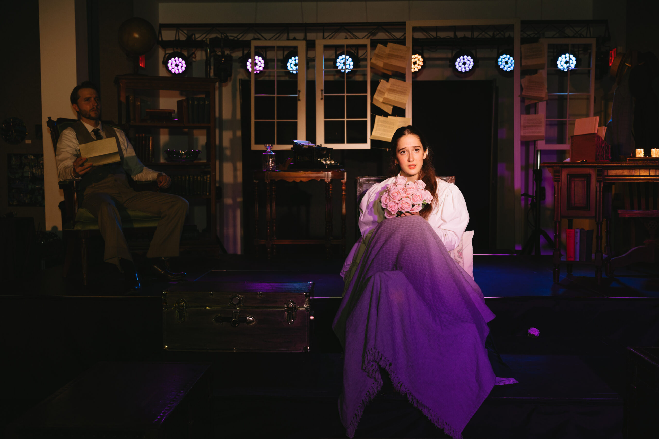  Panama City Theatre Company's performance of Daddy Long Legs May 2026, Jerusha sits in bed with flowers and Jervis reads a letter in chair